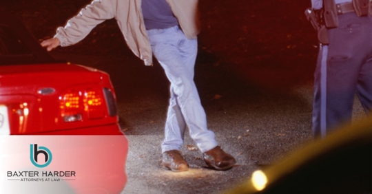 man taking field sobriety test in the dark